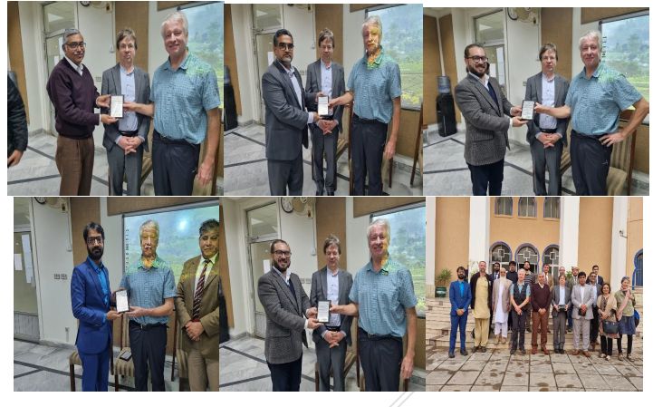Delegates and hosts exchanging tokens of appreciation